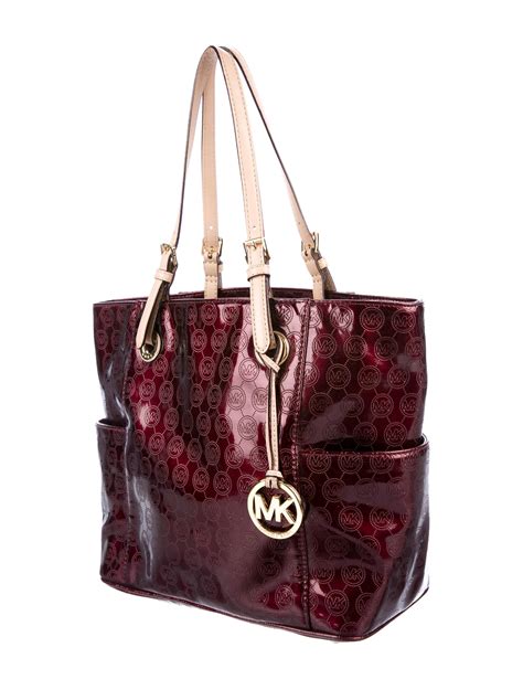 are all michael kors handbags leather|Michael Kors patent leather bag.